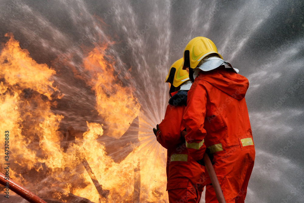 firefighter spray water to fire burning car workshop fire training firefighter spray water to fire burning car workshop fire training