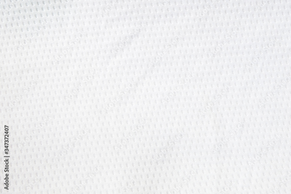 White mesh jersey fabric background. cloth sport wear texture for exercise. light weight, good air flow, cool and easy to dry from sweat. abstract wallpaper with copy space for text. White mesh jersey fabric background. cloth sport wear texture for exercise. light weight, good air flow, cool and easy to dry from sweat. abstract wallpaper with copy space for text.