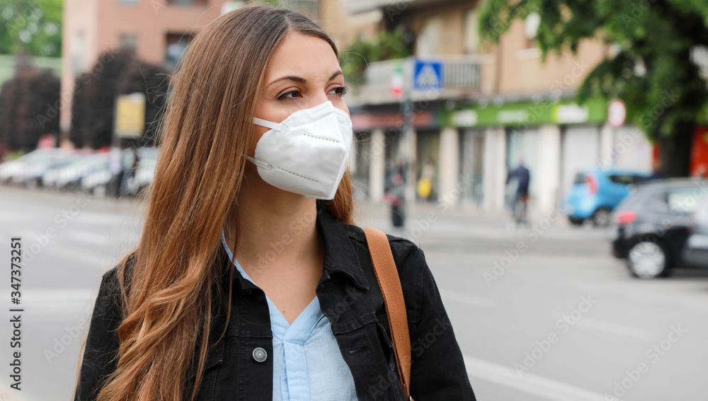 COVID-19 Pandemic Coronavirus Woman in city street wearing KN95 FFP2 ...