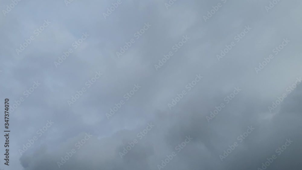 rain drops on a background of storm clouds on a blue sky background rain drops on a background of storm clouds on a blue sky background
