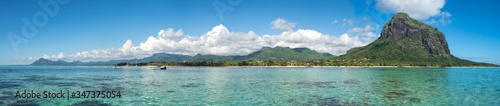 Fabulous panoramic view of the of mountains, colorful clouds and clear ocean/ Mauritius