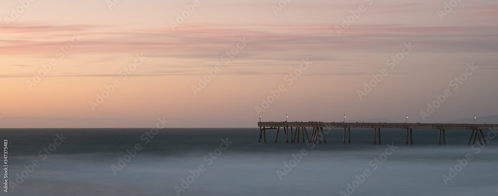 Long exposure of the pier under the late evening sky