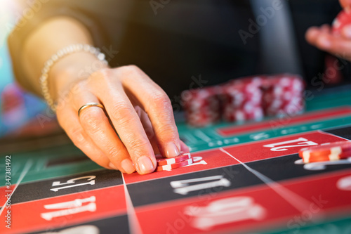 Woman playing roulette at the casino © Netfalls