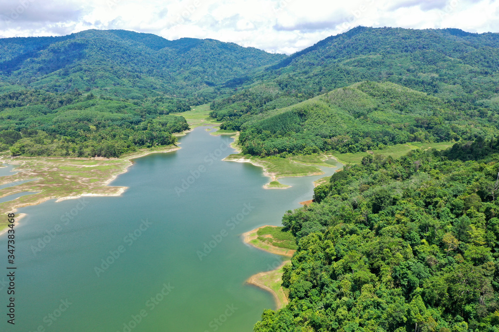 Beautiful Lake dam water reservoir And green forest Aerial view From Thailand