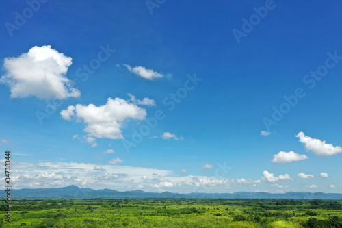 Beautiful green forest and Blue sky Aerial view From Thailand