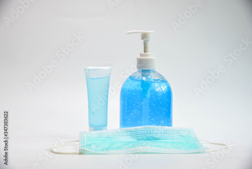 Blue colour alcohol gel portable type with bottled alcohol gel  for disinfecting the hands and face mask to prevent the inflection of epidemic Covid 19 isolated on white background