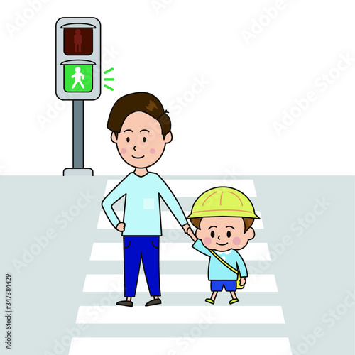青信号を渡る父と男の子
