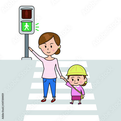 信号を渡る母と子