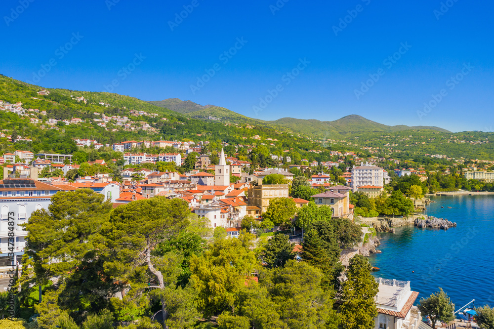 Croatia, beautiful town of Lovran and sea walkway, aerial panoramic view in Kvarner bay coastline, popular tourist destination