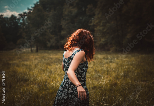 playful young woman in a field