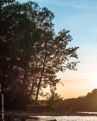 sunset over the lake and trees