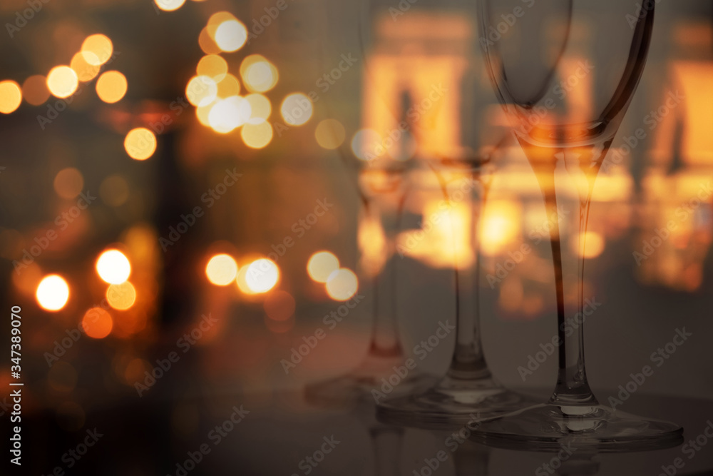 wine glass with blur party bokeh light of pub and bar dark night interior background