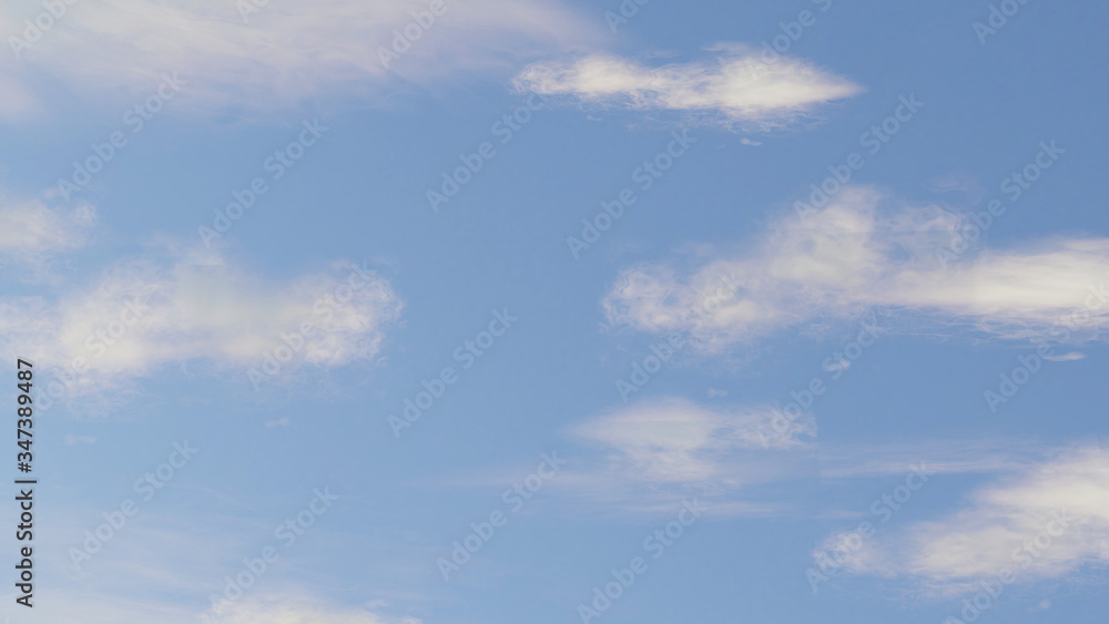 Cloudy white clouds and blue sky background. Shinny clear sky day with sun shine. Beautiful skyscape.