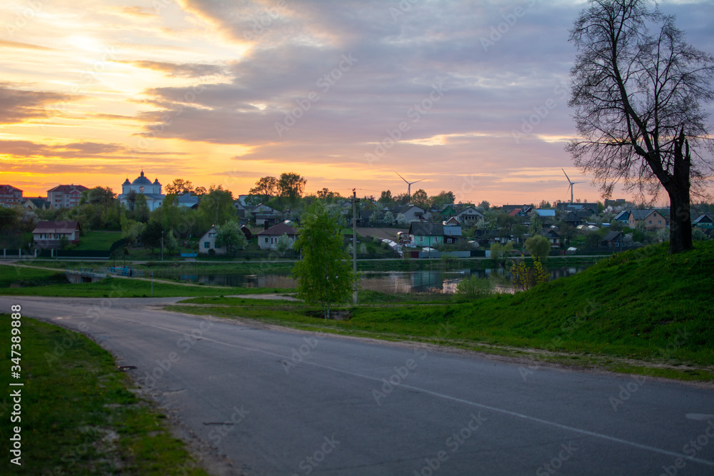 Church of the Intercession of the most Holy Theotokos at sunset. The view from the road poselok Veyno, Mogilev Belarus Church of the Intercession of the most Holy Theotokos at sunset. The view from the road poselok Veyno, Mogilev Belarus