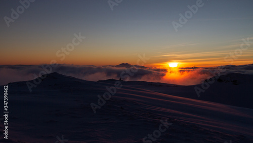 Sunset in a snowy Norwegian mountain