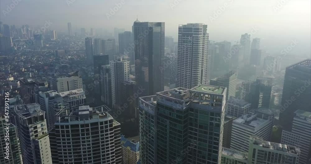 Ascending aerial flight over busy metropolitan city's skyline. Drone, 4K. Ascending aerial flight over busy metropolitan city's skyline. Drone, 4K.