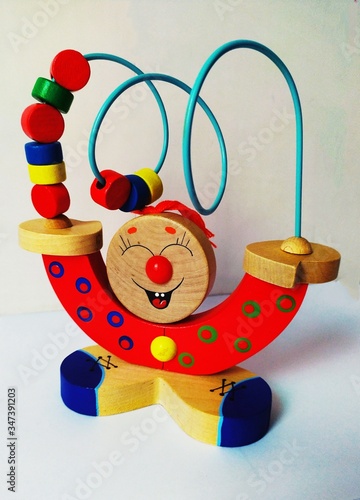 Children wooden fun toy with wire and rings