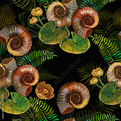 Ammonite fossil, yellow water lilies and palm leaves. Seamless pattern. Embroidery. Archeology and paleontology art. Prehistoric concept. Template for clothes. Ancient tropical forest © Matrioshka