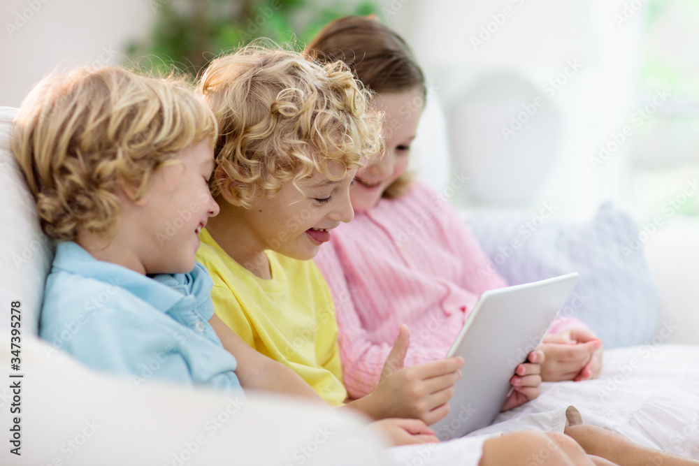 Kids with mobile phone. Child with tablet computer