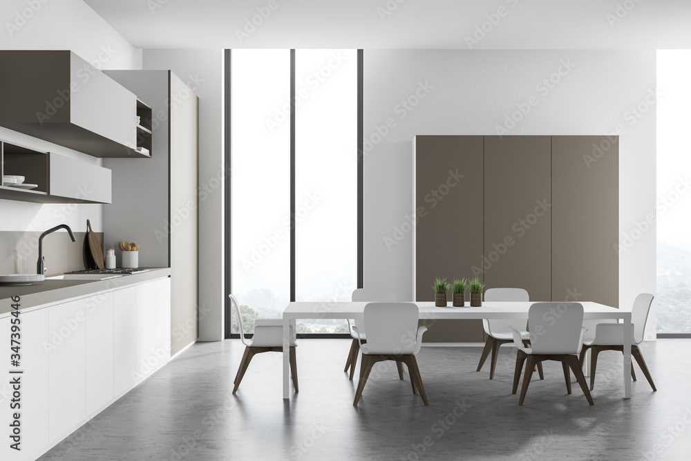 White and beige kitchen with table, side view White and beige kitchen with table, side view