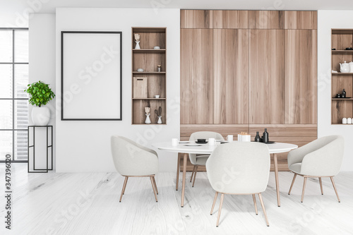 White and wooden dining room with poster