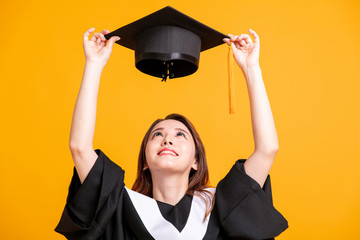   beautiful young female graduation looking the  graduate cap