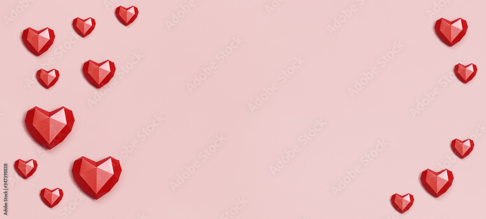 Banner with red polygonal paper heart shape on cream colored background. Holiday background with copy space for Valentines Day. Love concept. Plain colored. Minimal style.