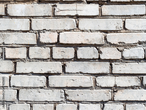 textured construction background - outdoor wall of old from house from white bricks photo