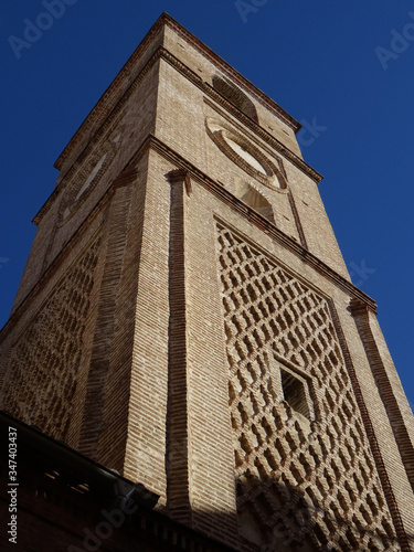 Mudejar bell tower with sebka decoration. Church of Santiago. 16 century. Old city center of Malaga. Spain. 