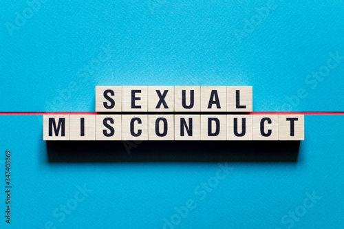 Sexual Misconduct word concept on cubes photo