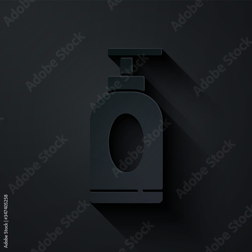 Paper cut Cream or lotion cosmetic tube icon isolated on black background. Body care products for men. Paper art style. Vector Illustration