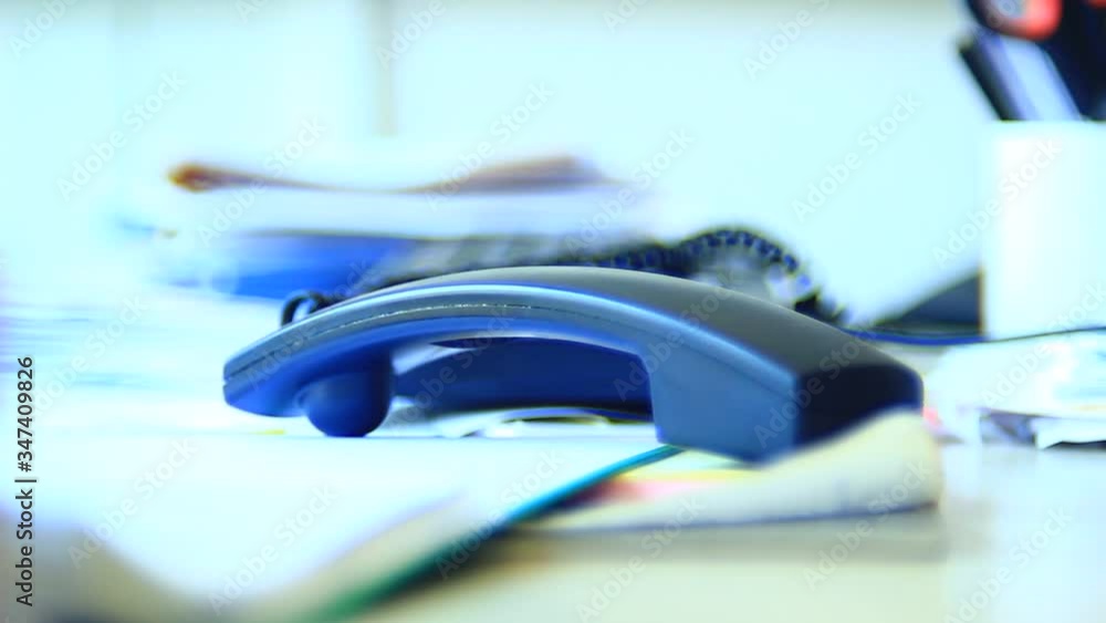 Very angry, unpredictable male, person, operating with telephone, waiting for a call, ending it. Office. Close up. Bright light. Very angry, unpredictable male, person, operating with telephone, waiting for a call, ending it. Office. Close up. Bright light.