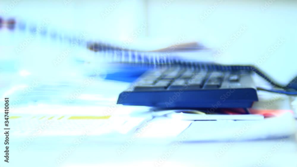 Very angry, unpredictable male, person, operating with telephone, waiting for a call, ending it. Office. Close up. Bright light. Very angry, unpredictable male, person, operating with telephone, waiting for a call, ending it. Office. Close up. Bright light.