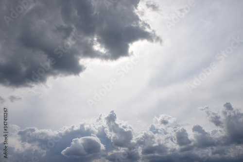 Wallpaper Mural cloud scape with dark grey rain clouds and copy space