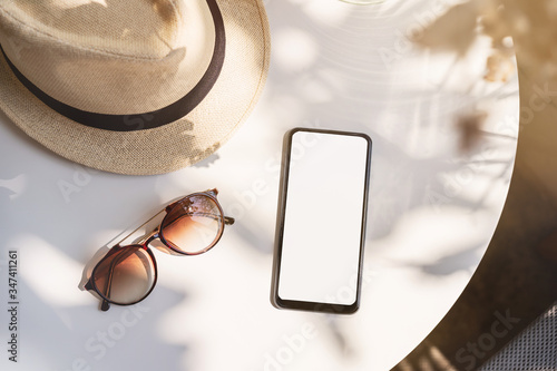Canvas Print Empty screen smart phone with travel accessories on the table, Summer vacation c