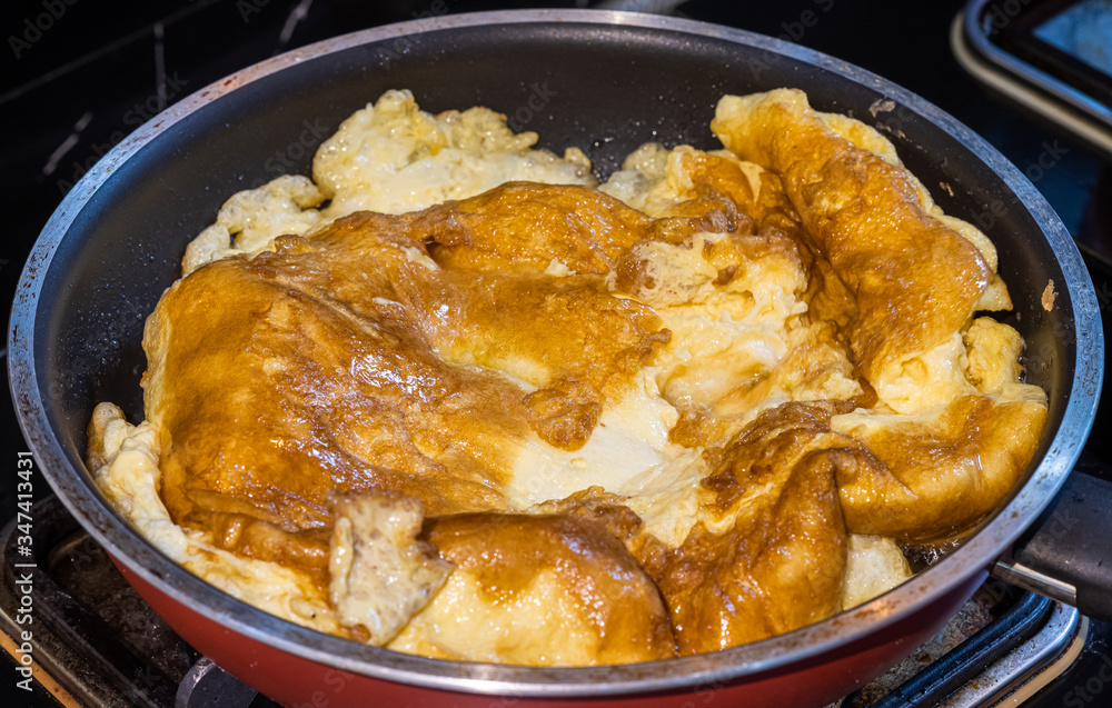 Delicious fried Thai omelet in a pan homemade cooking Delicious fried Thai omelet in a pan homemade cooking