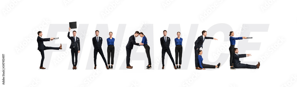 Group of people forming finance word at studio Group of people forming finance word at studio