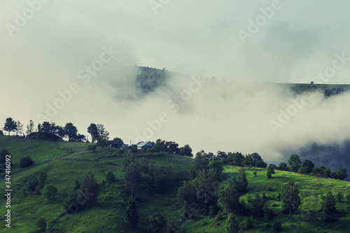 View of foggy summer day in mountains © beerlogoff
