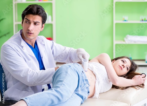 Pregnant woman visiting radiologyst for ultrasound