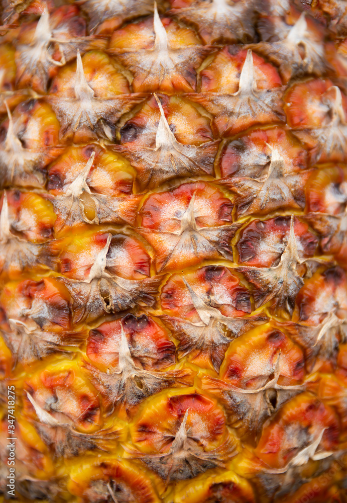 Ripe pineapple skin texture, tropical fruit background Ripe pineapple skin texture, tropical fruit background