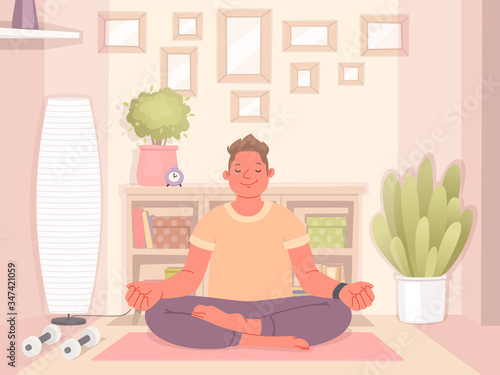 Happy man doing yoga at home. Meditation and healthy lifestyle during quarantine