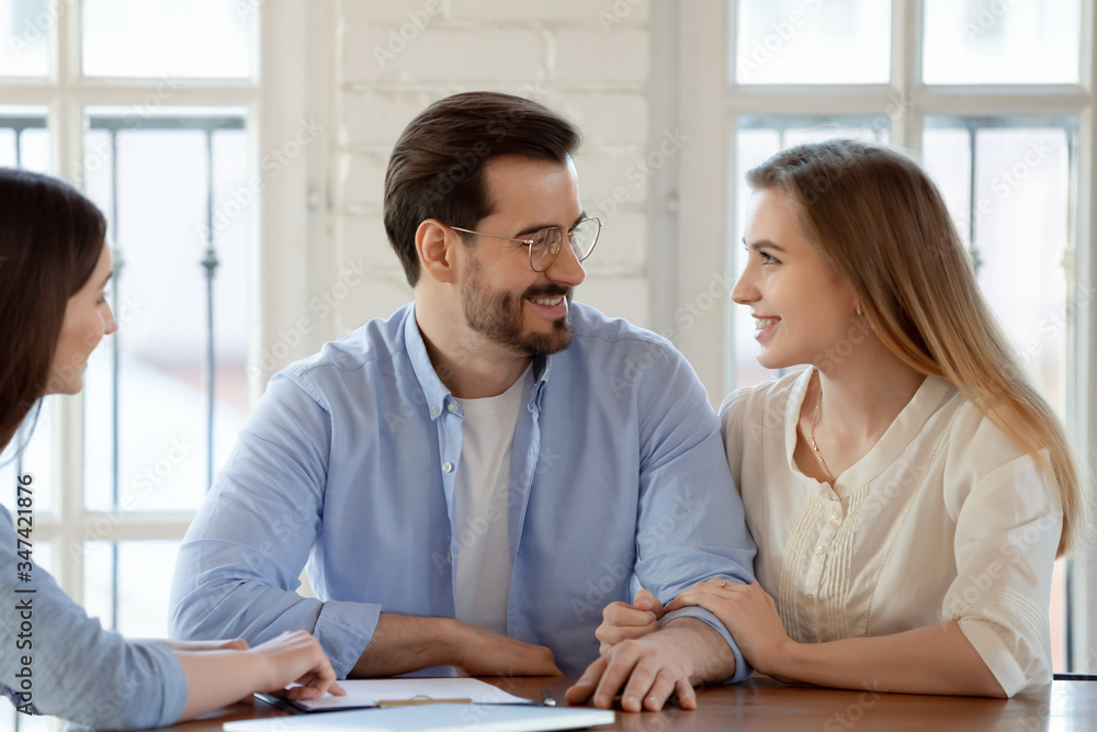 custom made wallpaper toronto digitalSmiling millennial couple talk discuss buying first house together with female real estate agent at meeting, happy young Caucasian husband and wife consult with female realtor or designer in office