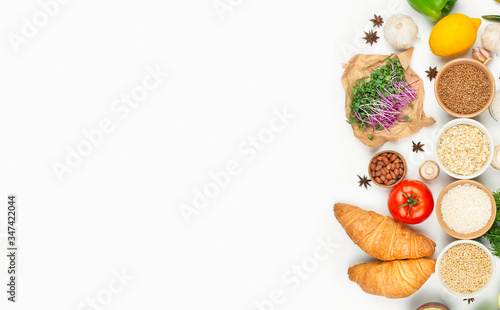 Food. Porridge, fresh vegetables and spices on a light background. Ingredients for cooking. Great food. Healthy eating Banner. Copy space.