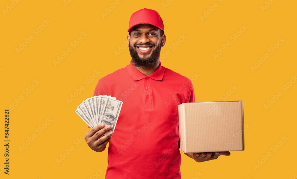 Courier Guy Holding Money Cash And Cardboard Box, Studio Shot Courier Guy Holding Money Cash And Cardboard Box, Studio Shot