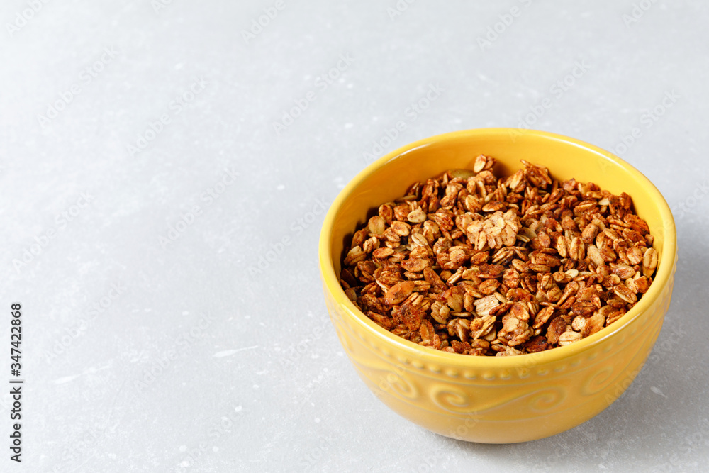 Oatmeal cereal granola bowl on ligth grey background Oatmeal cereal granola bowl on ligth grey background