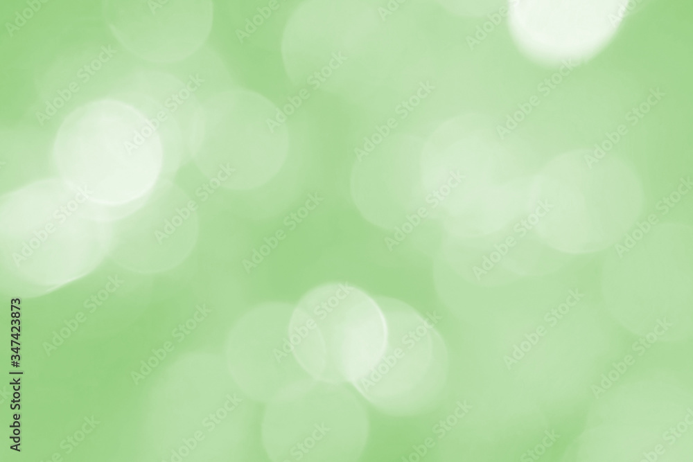 Beautiful spring, summer and festive background. Sunlight, ornament, spot, star and bokeh close-up. Green texture. Environmental theme of environmental protection, health. Beautiful spring, summer and festive background. Sunlight, ornament, spot, star and bokeh close-up. Green texture. Environmental theme of environmental protection, health.