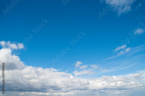 Fototapeta Naklejka Na Ścianę i Meble -  Background with blue sky with lots of white clouds