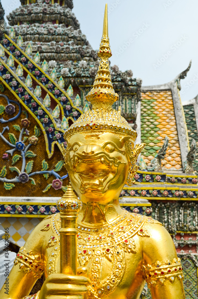 Lion Guard sculpture at Wat Arun Tample with golden surface in Bangkok background