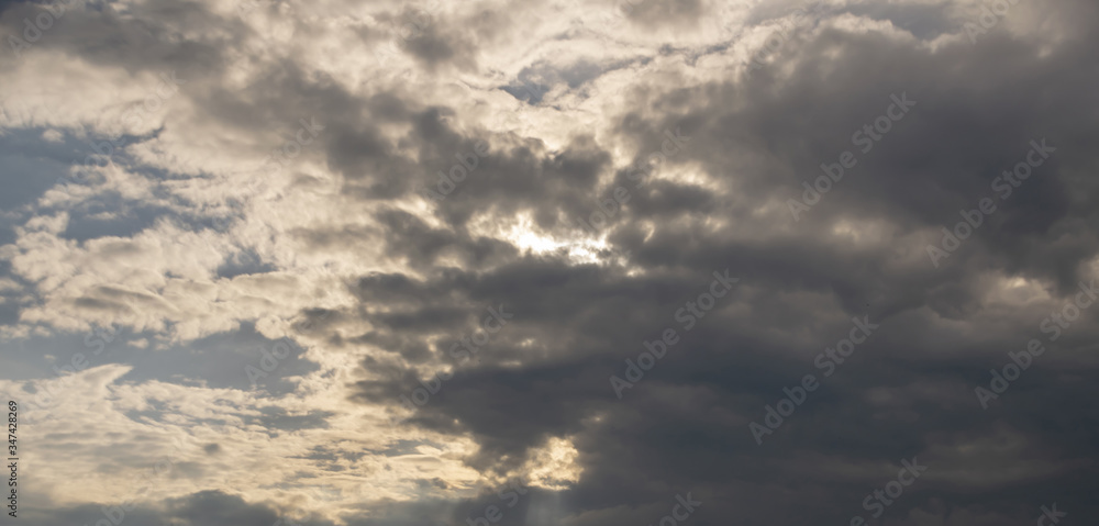 gray Cumulus clouds in a blue sky