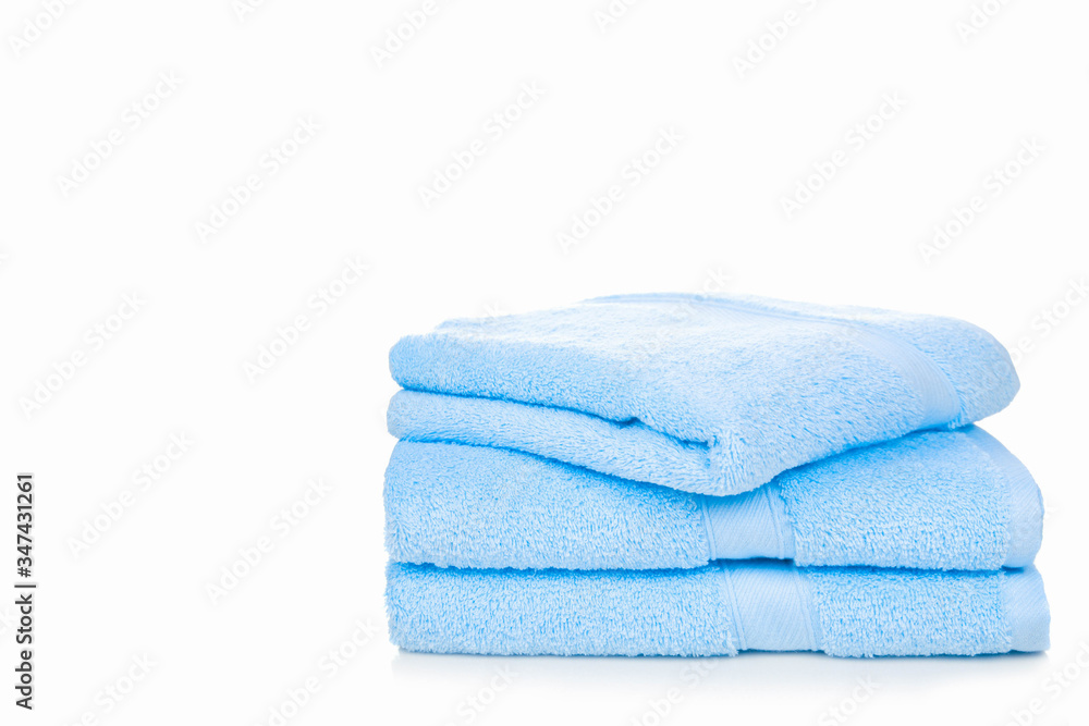 Blue towel isolated on white background with copy space Blue towel isolated on white background with copy space